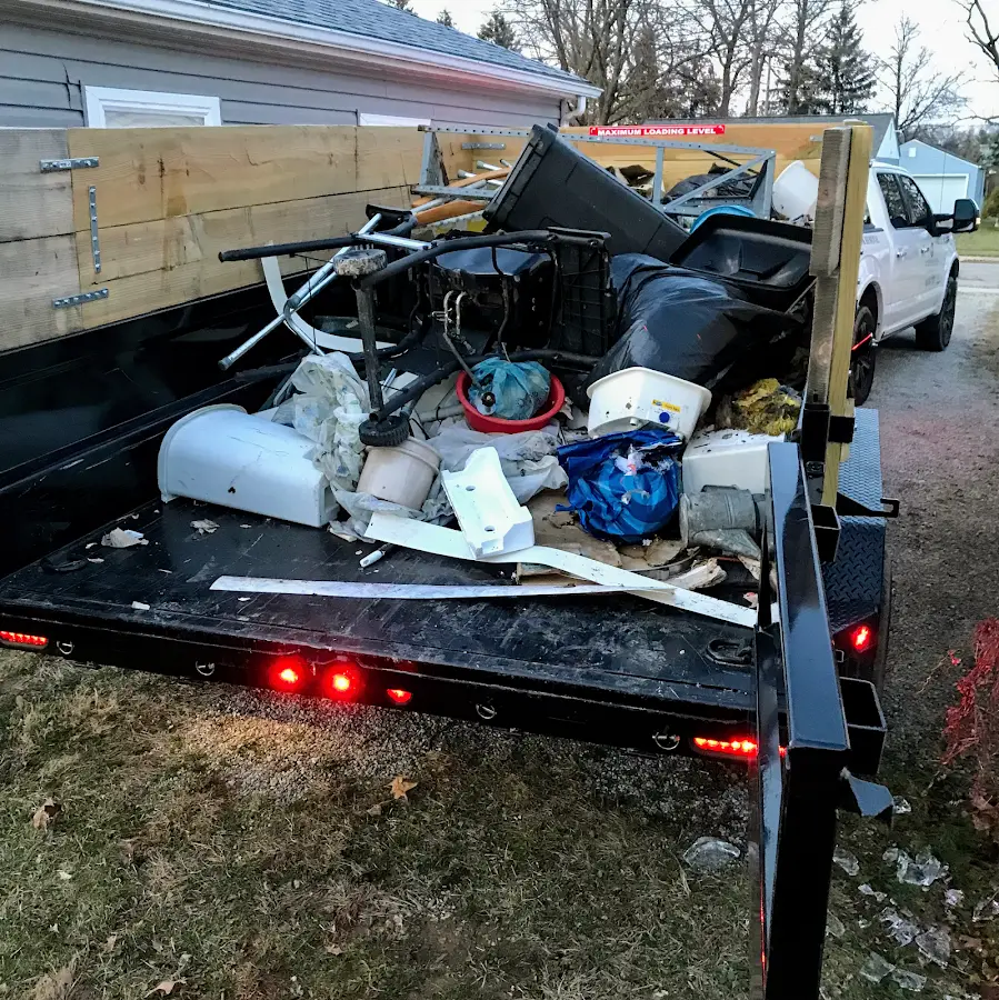 Roll-off dumpster delivered to a residential driveway in Almont